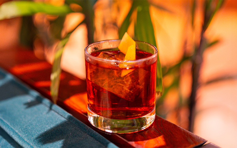 A Negroni served over ice with a twist of orange peel