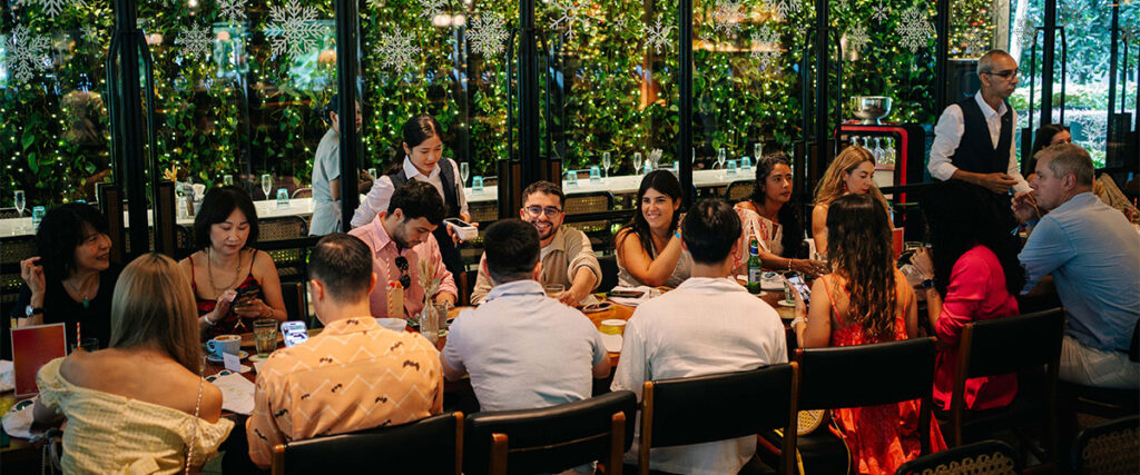 Friends enjoying group-friendly dining indoors at Publico restaurant.