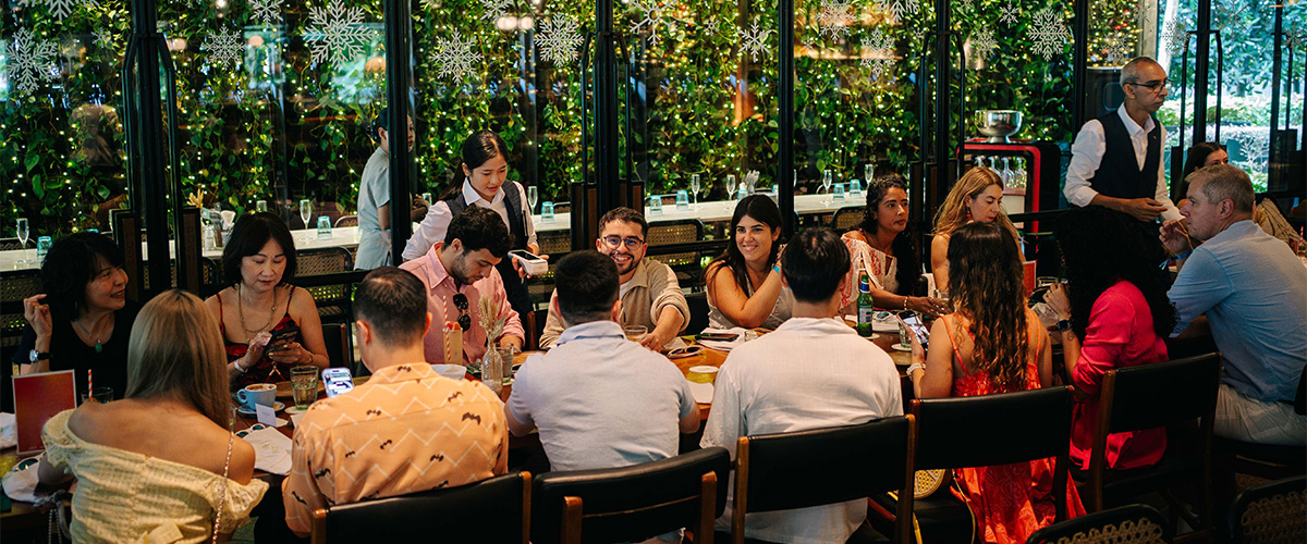 Friends enjoying group-friendly dining indoors at Publico restaurant.