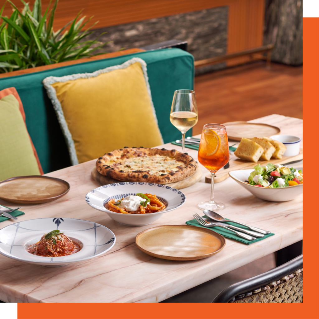 Italian lunch spread with pizza and sharing plates at Publico Singapore