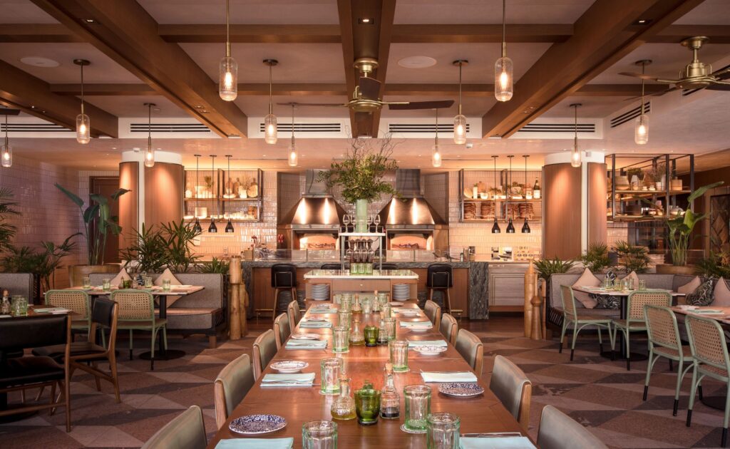 Interior of Publico Ristorante showing dining tables, warm lighting and the main restaurant seating area
